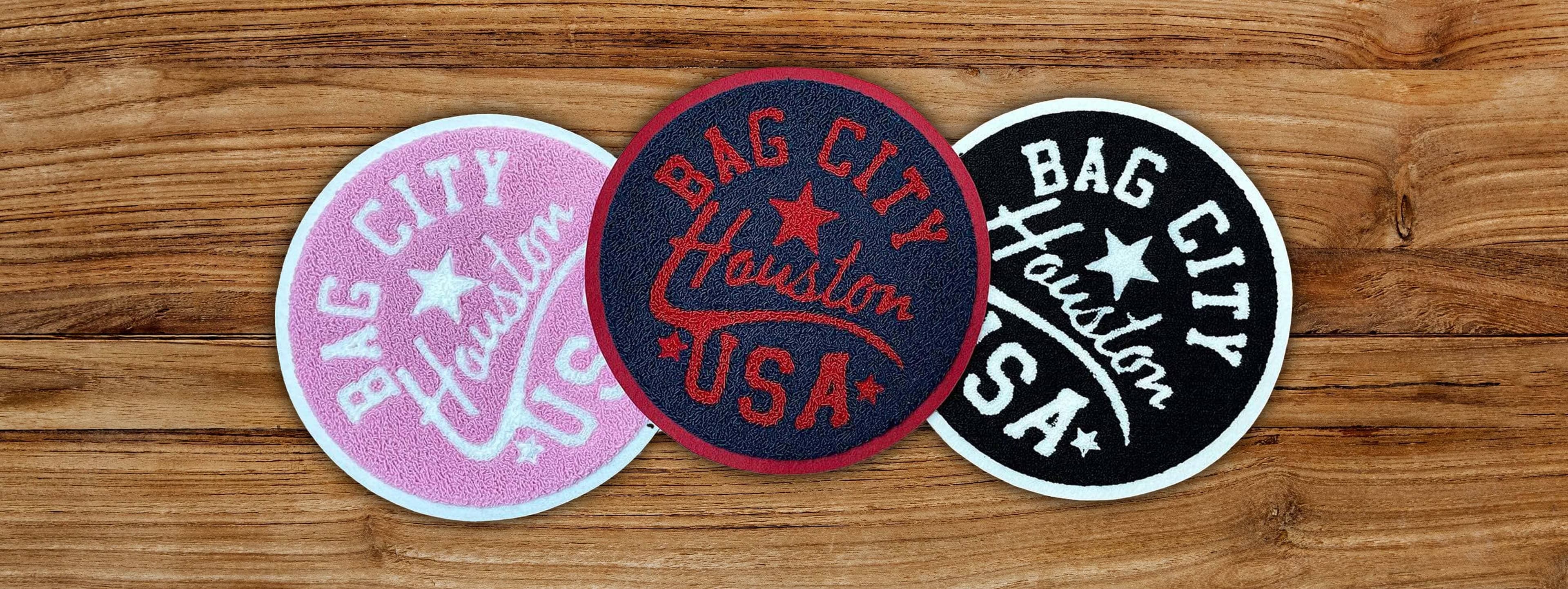 Embroidered chenille patches laid out on a workbench